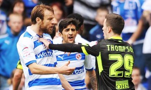 Leeds United's Zac Thompson, right, clashes with Reading's Kaspars Gorkss before being sent off