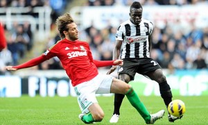 Newcastle United's Cheick Tiote and Swansea City's Miguel Michu